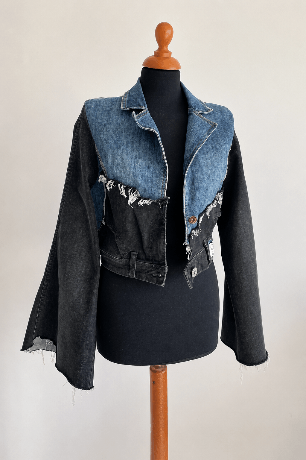 Black and blue upcycled denim jacket handcrafted from recycled jeans by Erilo