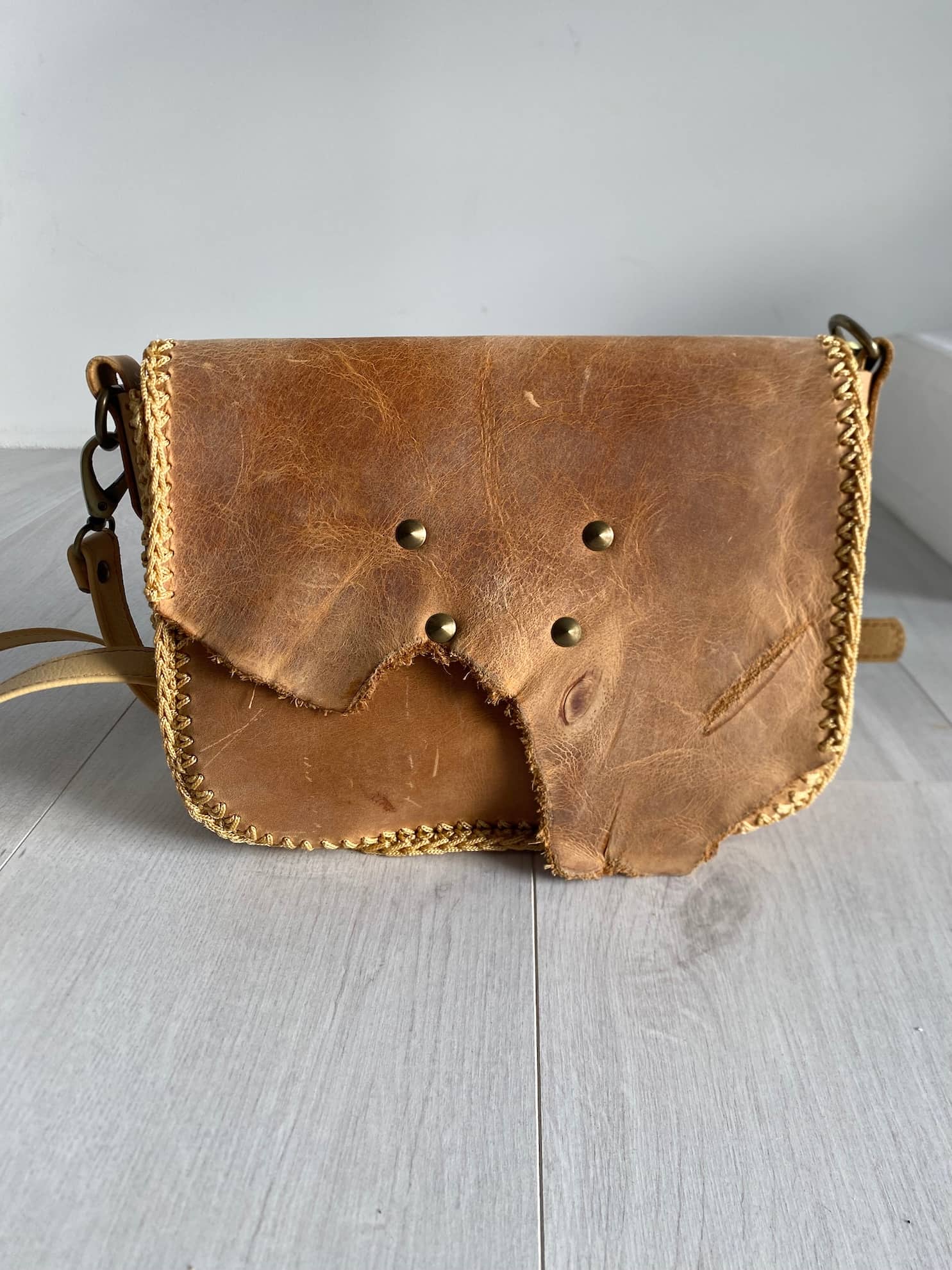 Amber brown leather crossbody bag front view